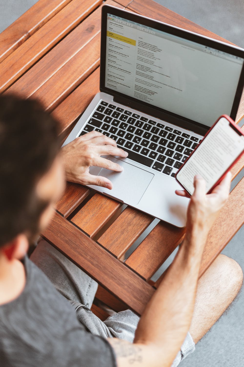 Focused Individual Working On Laptop