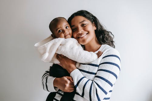 Joyful Embrace Between Mother And Child