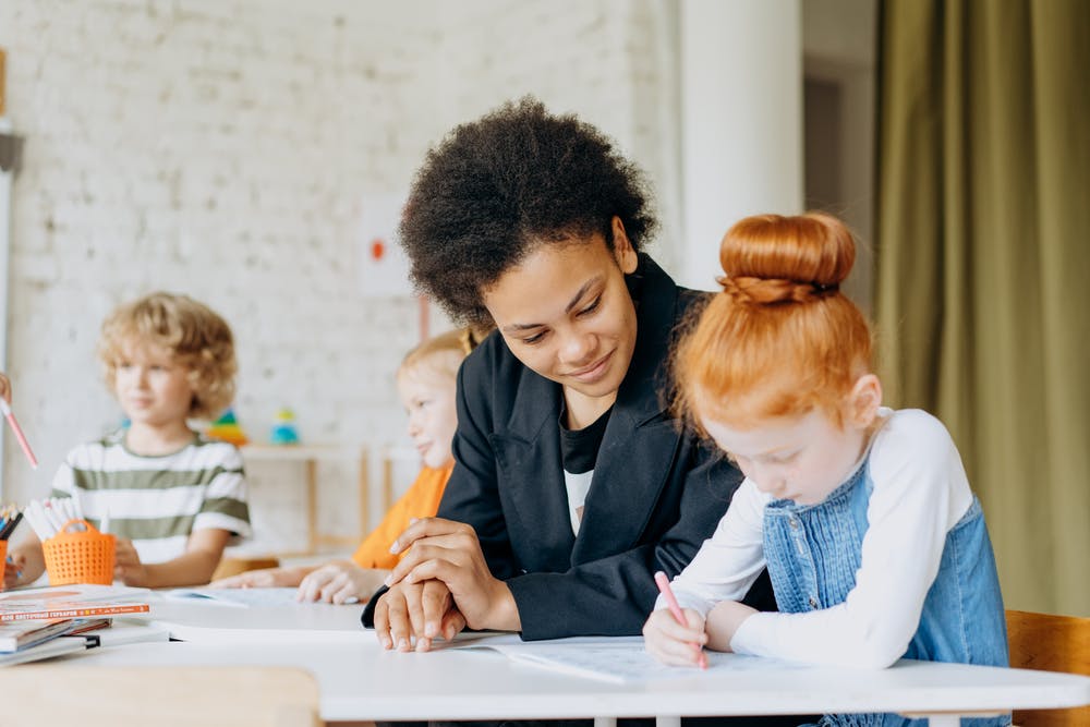 Engaged Teacher Guiding Young Learner